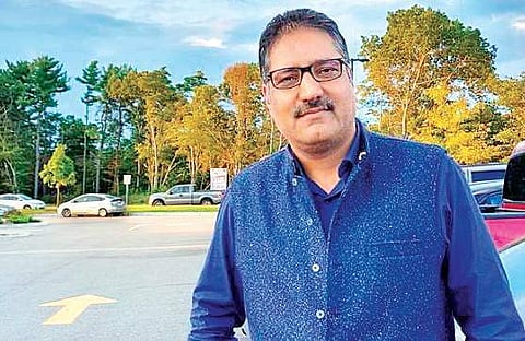 Shujaat Bukhari.