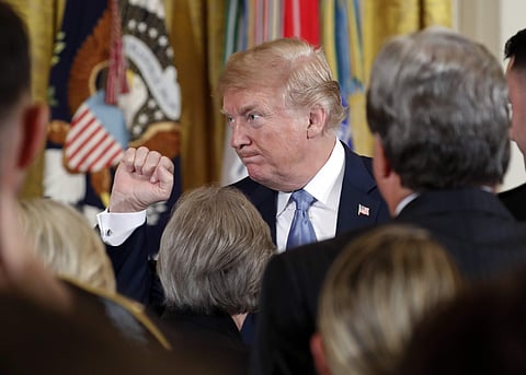 President Donald Trump gestures after awarding the Medal of Honor to 1st Lt. Garlin Conner, posthumous recognition, during a ceremony in the East Room of the White House in Washington, Tuesday, June 26, 2018. | Associated Press