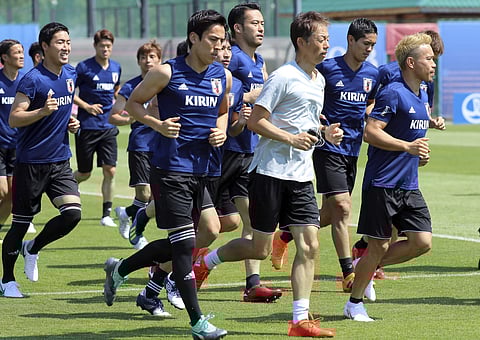 Players warm up during a training session of Japan national team | AP