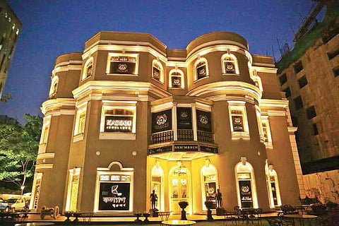Hues of dark brown, red// look striking against the stained glass skylight/The restored RNM Galleria 1901