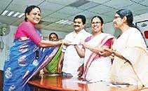 Health Minister K K Shylaja presenting the scholarship to Ranjini Pillai in Thiruvananthapuram on Thursday