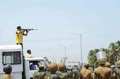 In this 22 May 2018 photo, a police personnel shoots at the protesters protesting against the copper smelting plant in Thoothukudi. (EPS)