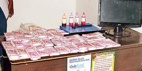 Bundles of counterfeit D2,000 notes that were seized from Velandipalayam in Coimbatore on Saturday | Express