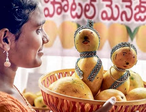 around 18 different varieties of mangoes are being exhibited and sold at the fest | Express