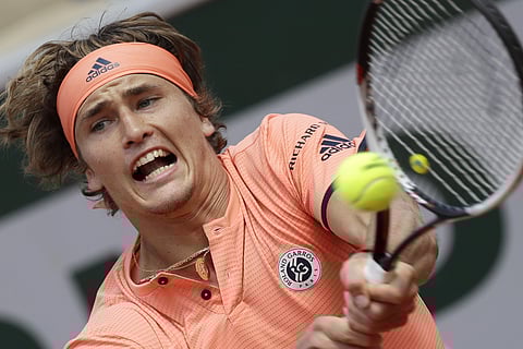Germany's Alexander Zverev returns a shot against Russia's Karen Khachanov during their fourth round match of the French Open tennis tournament at the Roland Garros stadium in Paris. (AP)