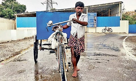 A conservancy worker after collecting domestic waste at ICF  |  Express