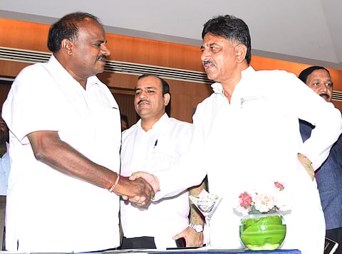 Karnataka Chief Minister Kumaraswamy speaks to Congress MLA DK Shivakumar after JDS and congress party Joint Meeting in Bengaluru on June 1, 2018. (Express Photo by Vinod Kumar)