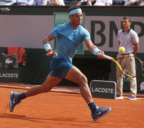 Spain's Rafael Nadal returns a shot against Argentina's Diego Schwartzman during their quarterfinal match of the French Open tennis tournament. | AP