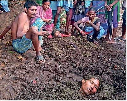 Villagers bury two lightning victims in the ground at Kanjangmandi under Kashipur block in Rayagada district | EXPRESS