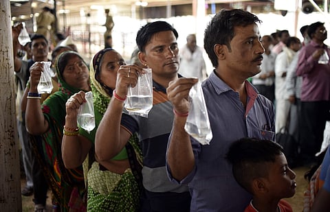 The annual distribution of traditional fish medicine that is beleived to cure Asthma and other respiratory illness has begun at Exhibition Grounds at Nampally in Hyderabad. (EPS | Vinay Madapu)