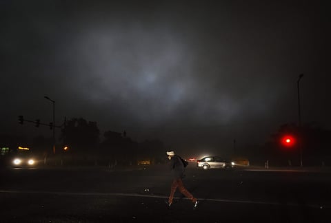 Delhi Vehicles ply at a road with headlights on as it gets dark before a thunderstorm at Vijay Chowk in New Delhi on Saturday June 09 2018. | pti