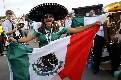 A Mexico's football fan dances ahead of the group F match between Germany and Mexico at the 2018 soccer World Cup in the Luzhniki Stadium in Moscow, Russia, Sunday, June 17, 2018. | AP