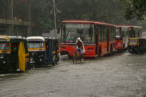 People in Thane battle the incessant downpour. (Photo | PTI)