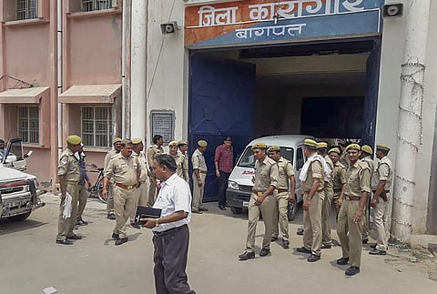 Police personnel at the Baghpat District Jail where gangster Munna Bajrangi was shot dead allegedly by an inmate of the jail in Baghpat on Monday July 9 2018. | PTI
