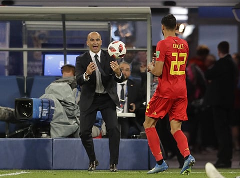 Belgium coach Roberto Martinez goes for the ball during the semifinal match between France and Belgium at the 2018 soccer World Cup in the St. Petersburg Stadium, in St. Petersburg, Russia, Tuesday, July 10, 2018. | AP