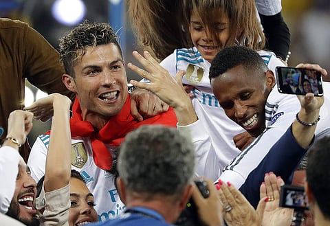 Cristiano Ronaldo celebrates with fans after winning the Champions League Final match between Real Madrid and Liverpool on May 26, 2018. (File photo | AP)