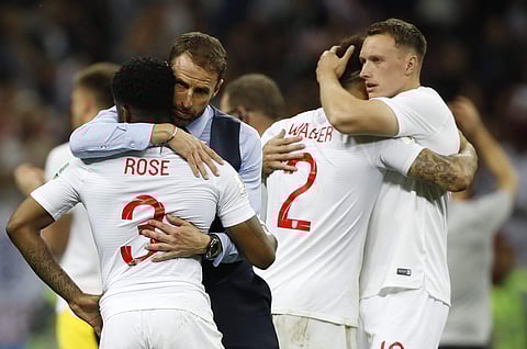England head coach Gareth Southgate, 2nd left, comforts England's Danny Rose, left, after loosing the semifinal match between Croatia and England at the 2018 soccer World Cup in the Luzhniki Stadium in Moscow, Russia, Wednesday, July 11, 2018. | AP