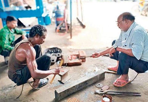 Aswini Mishra (Right) working on the brake system (Photo | EPS)