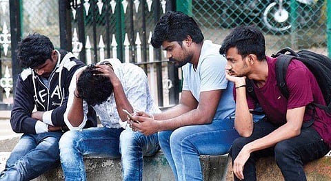 Sharavan’s colleagues wait outside the Victoria Hospital mortuary | vinod kumar t