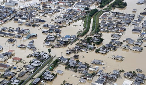 More than 70,000 military, police and firefighters have fanned out to tackle the aftermath of the floods in Japan | AP