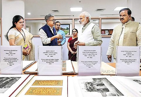 PM Narendra Modi speaks with Culture Secretary Raghvendra Singh during the opening of Dharohar Bhawan, the new building of Archaeological Survey of India. | PTI
