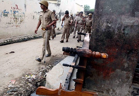 Policemen patrol a street during curfew in Muzaffarnagar. (File Photo | PTI)
