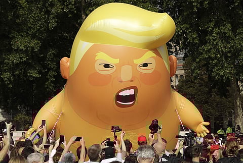 Campaigners raised more than 29,000 pounds to pay for a giant balloon and have said it is intended as a humorous protest to counter the 'misery' created by Trump. (Photo | AP)