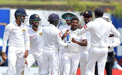 Sri Lanka's Rangana Herath (C) celebrates with his teammates after he dismissed South Africa's Dale Steyn during the third day of the opening Test match between Sri Lanka and South Africa at the Galle International Cricket Stadium in Galle. (Photo | AFP)