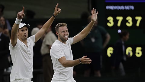 Mike Bryan and Jack Sock, right, of the United States celebrate winning their men's doubles final match against South Africa's Raven Klaasen and New Zealand's Michael Venus at the Wimbledon Tennis Championships, in London, Saturday July 14, 2018. | AP