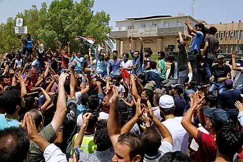 Iraqi protesters gather in front of the provincial council building during a demonstration in Basra, 340 miles (550 km) southeast of Baghdad, Iraq. (Photo | AP)