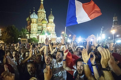 France's soccer fans celebrate in Red square, with the St. Basil's Cathedral in the background, after their team won the final match between France and Croatia. (AP)