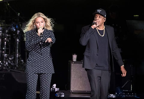 Beyonce, center, and Jay-Z perform during a Democratic presidential candidate Hillary Clinton campaign rally in Cleveland. (File | AP)