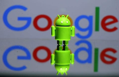 A 3D printed Android mascot Bugdroid is seen in front of a Google logo. (File | Reuters)