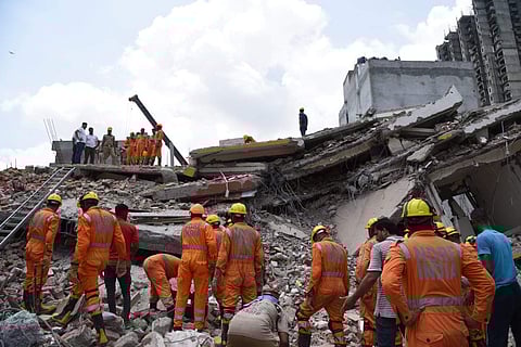 NDRF teams involved in search and rescue operations at the building collapse site in Greater Noida. (Photo | Parveen Negi / EPS)