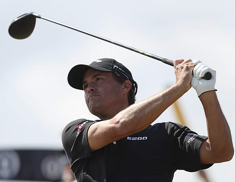 Kevin Kisner of the US plays off the 18th tee during the first round of the British Open Golf Championship in Carnoustie, Scotland. | AP