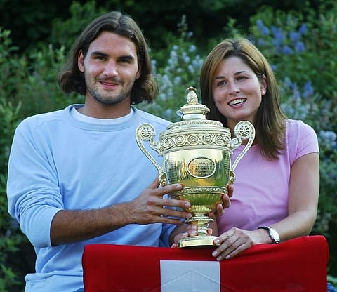 July 8, 2003: Roger Federer of Switzerland sits with his girl friend Mirka Vavrinec after he won his Men's Final match against Mark Philippoussis of Australia at the Wimbledon Tennis Championships. (Photo | AFP)