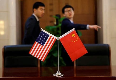 Chinese and U.S. flags are set up for a signing ceremony. (File | Reuters)