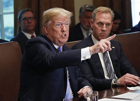 President Donald Trump gestures while speaking during his meeting with members of his cabinet in Cabinet Room of the White House in Washington. (Photo | AP)