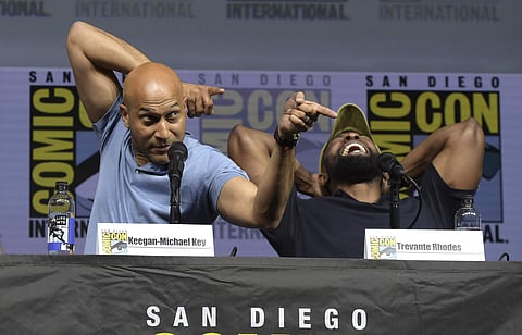 Keegan-Michael Key, left, points to the crowd as Trevante Rhodes laughs at the 20th Century Fox 'The Predator' panel on day one of Comic-Con International on Thursday, July 19, 2018, in San Diego. (Photo | AP)