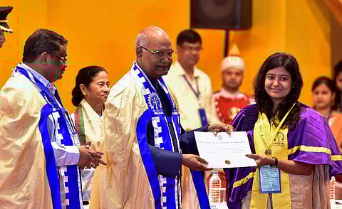 President Ram Nath Kovind presents a certificate and a gold medal to Soumya Dubey during the 64th Annual Convocation of IIT Kharagpur in Paschim Medinipur district on Friday July 20 2018.West Bengal Chief Minister Mamata Banerjee and Director IIT Kharagpu