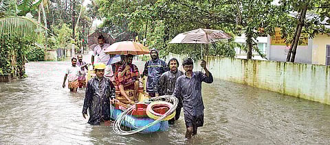 Fire and Rescue Services personnel shifting people who got stranded near Kanjiram temple, in Kottayam on Thursday | Vishnu  Prathap