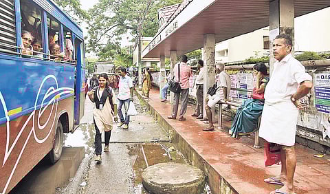 People waiting at Kerala High Court junction bus stop in Kochi | Albin Mathew