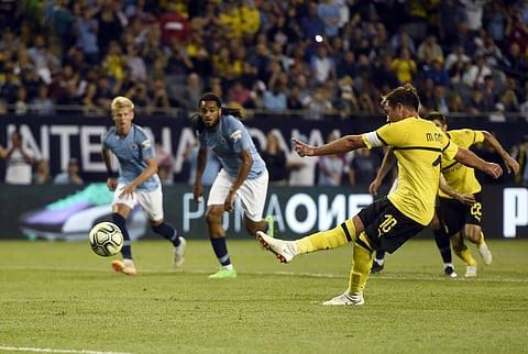 Borussia Dortmund midfielder Mario Gotze, right, scores a goal during the first half of an International Champions Cup tournament match against Manchester City. (Photo | AP)