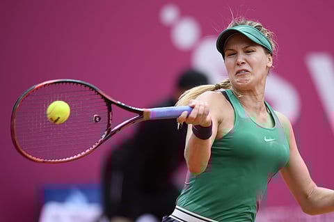 Eugenie Bouchard of Canada, returns a ball to Alize Cornet of France, during their semi-final game at the WTA Ladies Championship tennis tournament in Gstaad. | AP