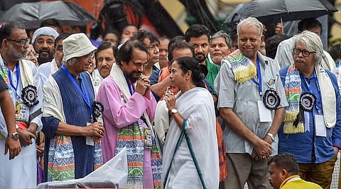 West Bengal Chief Minister Mamata Banerjee being greeted by Trinamool Congress party activists during the annual Martyr's Day rally in Kolkata on Saturday July 21 2018. | PTI