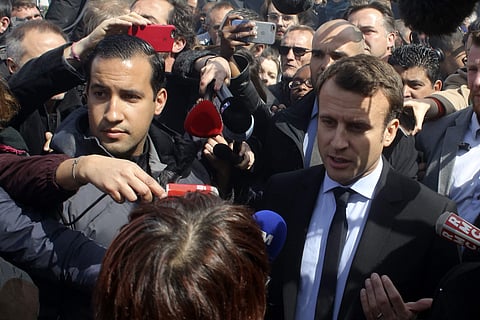 Emmanuel Macron, right, is flanked by his bodyguard, Alexandre Benalla, left, outside the Whirlpool home appliance factory, in Amiens, northern France.( Photo | AP)