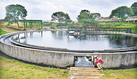 A technician collects sample from the water treatment plant at Challaghatta in Bengaluru for testing | Pushkar V