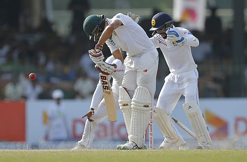 South Africa's Hashim Amla is bowled out by Sri Lanka's Rangana Herath during the day three of their second test cricket match in Colombo, Sri Lanka. (Photo | AP)