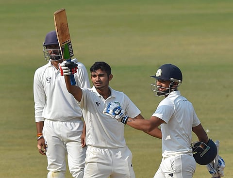Vidarbha batsman Akshay Wadkar celebrates his century during the 3rd day of the Ranji Trophy final cricket match against Delhi. (File Photo| PTI)