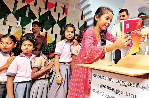 Students of Government Girls’ School contributing books to Abhimanyu’s Maharaja’s library in Kochi on Tuesday | Express
